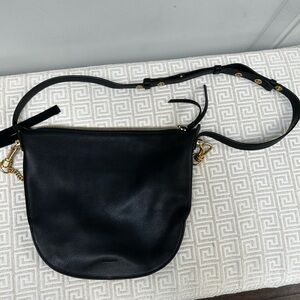 All Saints Black and Gold Hobo Bag with Sleek Crescent Design